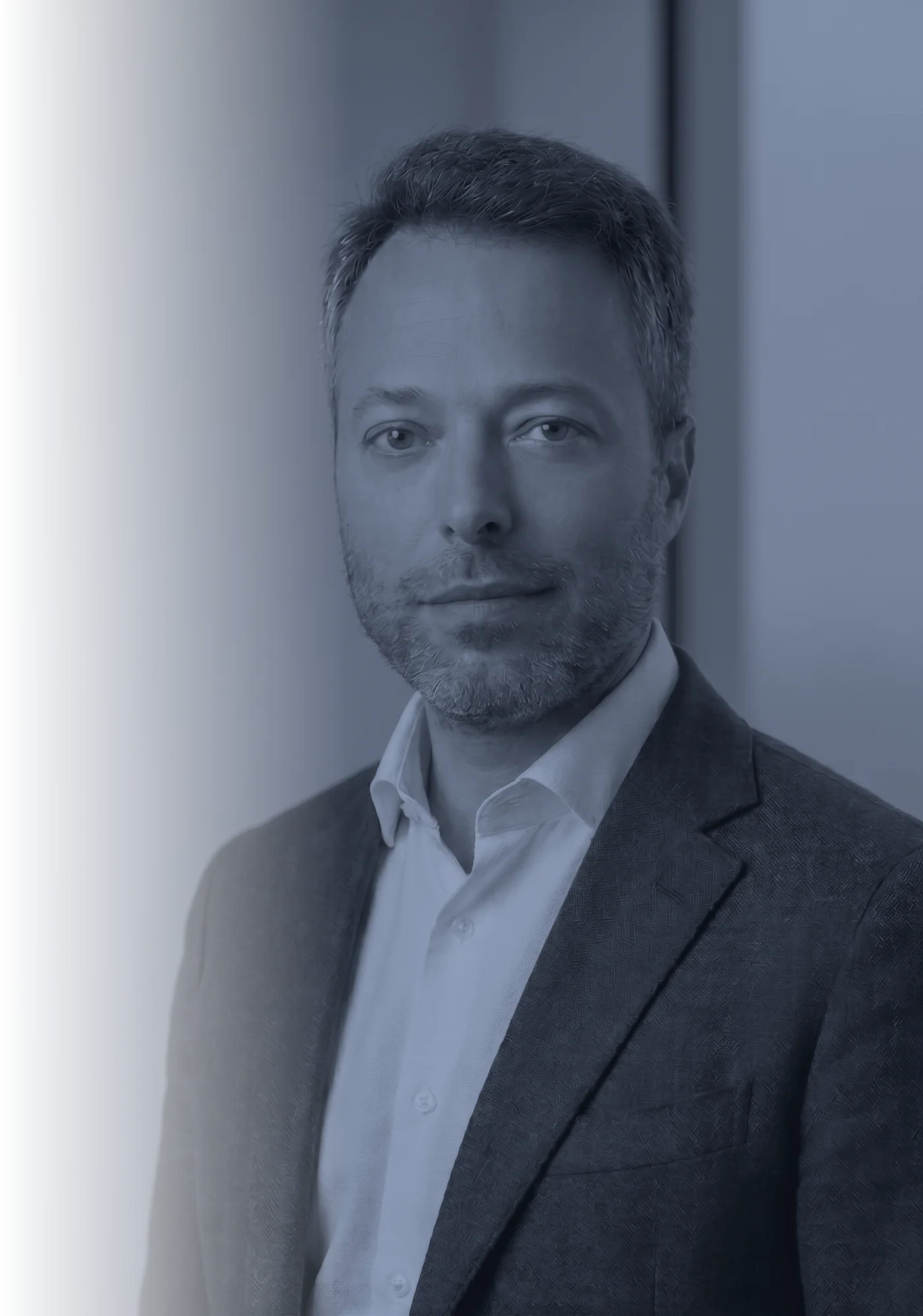 Giacomo Schiaroli, Founder & Creative Director of Schiaroli Yacht Design, in a dark jacket and open-collared shirt.